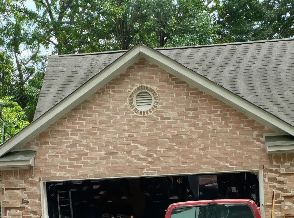 Roof of a home in Clinton, job photo: looking a at roof that is damaged by hail. The roof is leaking and they need the roof repaired