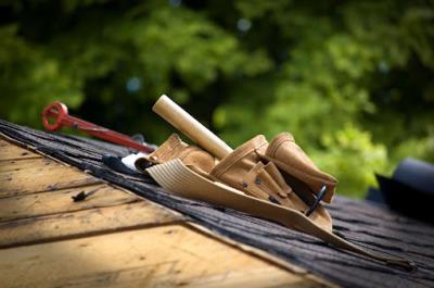 Roofing tools resting on a Knoxville roof during a roof repair.