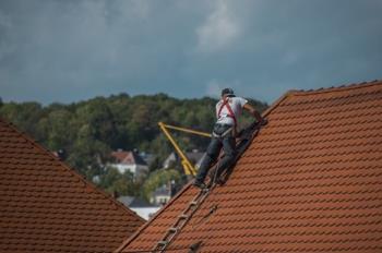 Mobley Brothers Roofing and Renovation LLC roofer working on repairing a roof in Brentwood